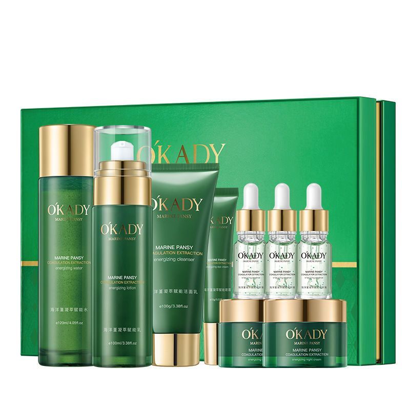 OKADY skincare product set with green and gold packaging on a white background