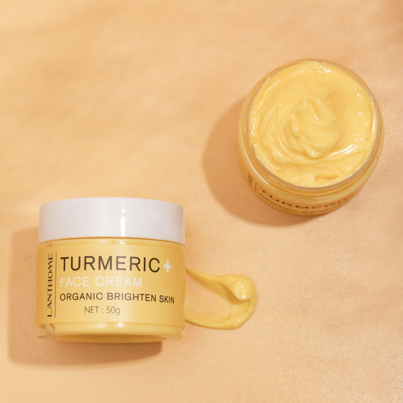 Lanthome Turmeric Face Cream jar with open lid on a beige background