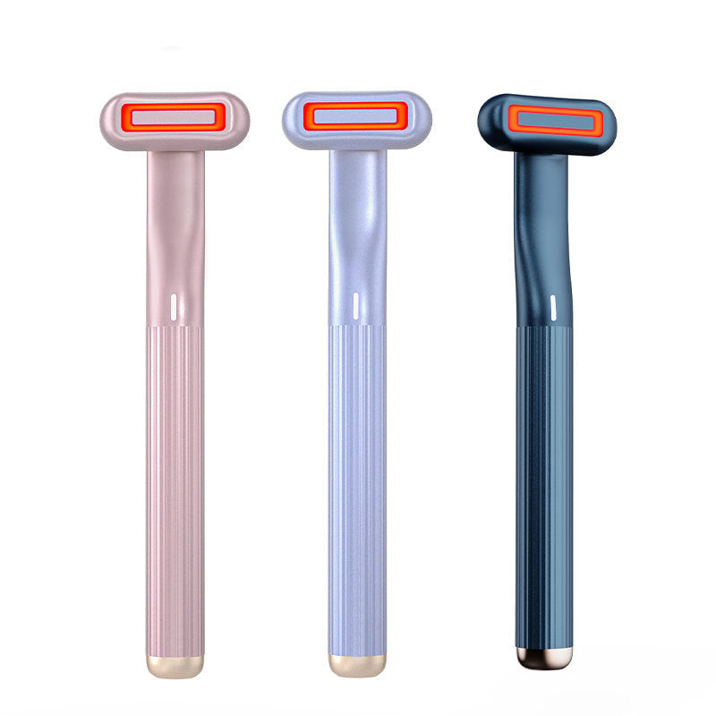 Three razors in pink, blue, and gray on a white background