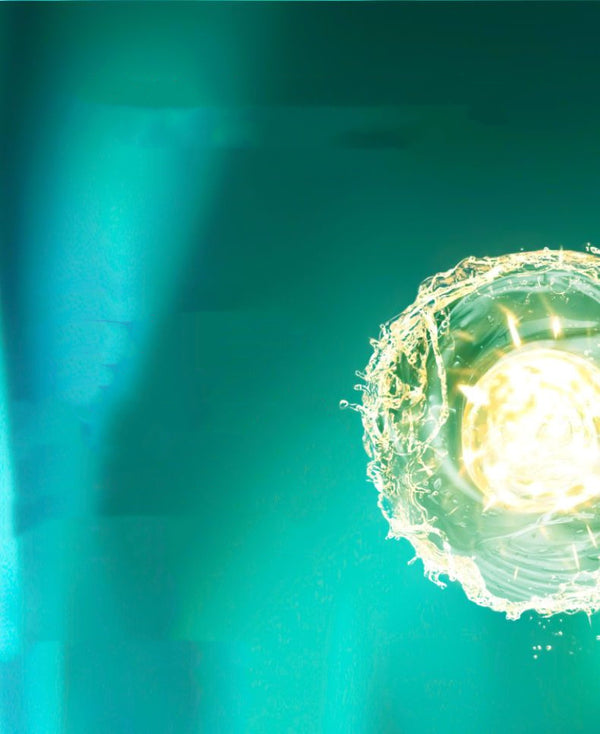 Close-up of a fertilized egg with a bright light source on a green background