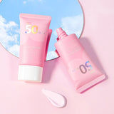 Two pink sunscreen bottles with SPF 50 on a pink background