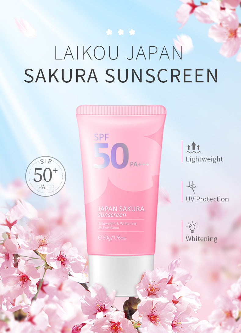 Pink sunscreen tube with cherry blossoms and 'Laikou Japan Sakura Sunscreen' text on a light blue background.