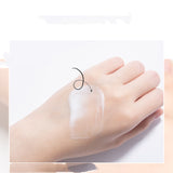 Transparent adhesive patch on a person's foot against a white background