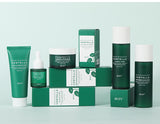 Collection of IREV skincare products on a light green background