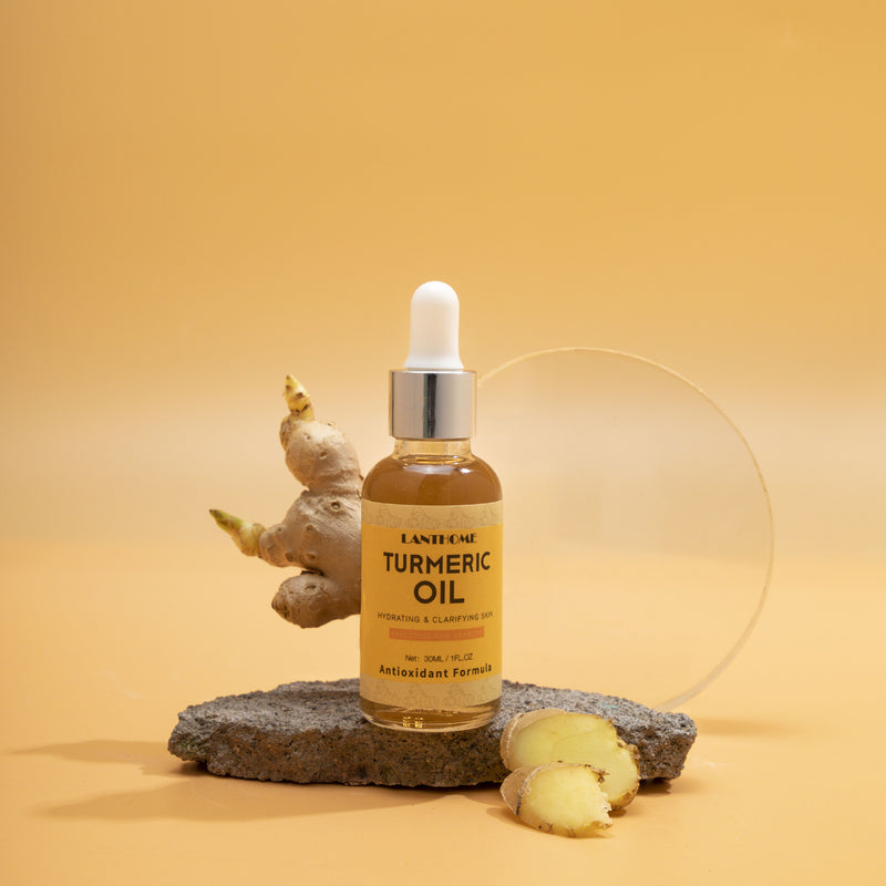 Bottle of turmeric oil with a dropper on a stone surface against a yellow background