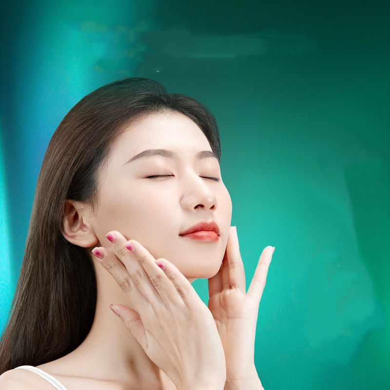 Woman touching her face against a teal background