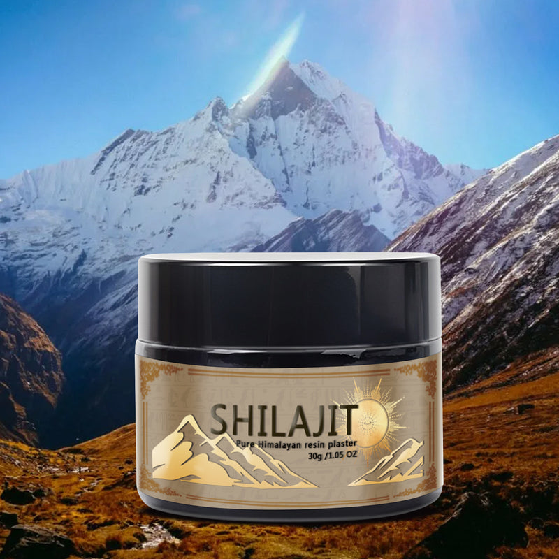 A jar of SHILAJIT resin paste on a background featuring a mountainous landscape with snow-capped mountains.