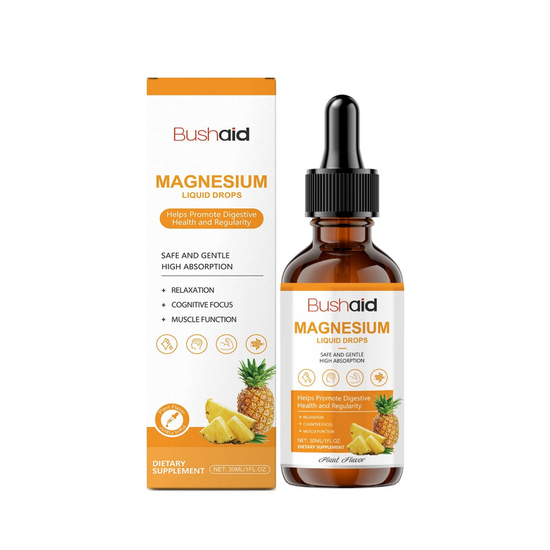 A bottle of Bushaid Magnesium Supplement Drops with a dropper, next to its packaging box featuring an image of a pineapple and slices of orange.